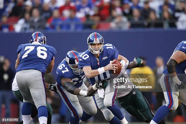 Football: New York Giants QB Eli Manning in action, under pressure vs Philadelphia Eagles, East Rutherford, NJ