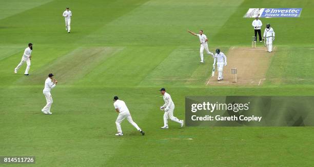 Stuart Broad of England celebrates dismissing Quinton de Kock of South Africa during day one of the 2nd Investec Test match between England and South...