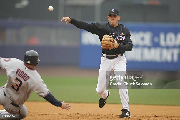 Baseball: New York Mets Chris Woodward in action, turning double play vs Washington Nationals Jose Vidro during slide, Flushing, NY 4/23/2005