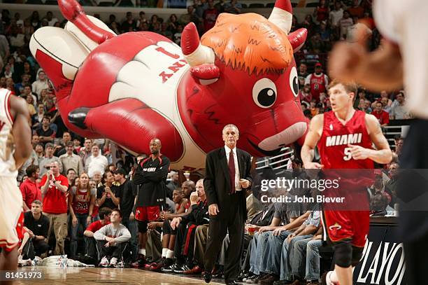 Basketball: NBA Playoffs, Miami Heat coach Pat Riley on sidelines during Game 1 vs Chicago Bulls, View of giant bull mascot balloon in background,...