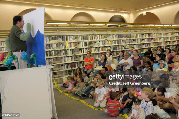 The audience watching a puppet show at The Art of Storytelling International Festival.