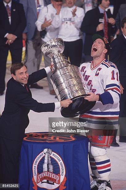 Hockey: Stanley Cup finals, New York Rangers Mark Messier victorious with trophy and NHL commissioner Gary Bettman after game vs Vancouver Canucks,...