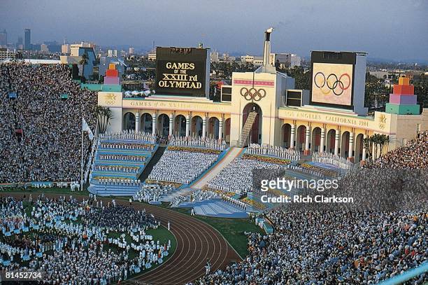 Opening Ceremony: 1984 Summer Olympics, Overall view of USA Rafer Johnson lighting torch at Memorial Coliseum, Los Angeles, CA 7/28/1984