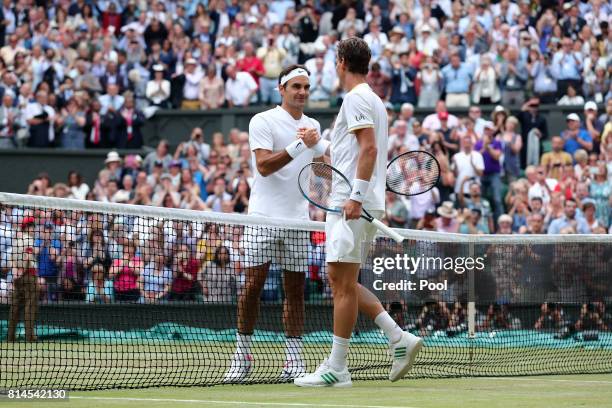 Roger Federer of Switzerland and Tomas Berdych of The Czech Republic shake hands after the Gentlemen's Singles semi final match on day eleven of the...