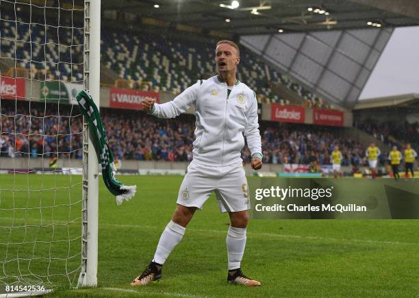 Leigh Griffiths of Celtic ties a Celtic scarf onto a goalpost which sparked crowd disorder after the Champions League second round first leg...