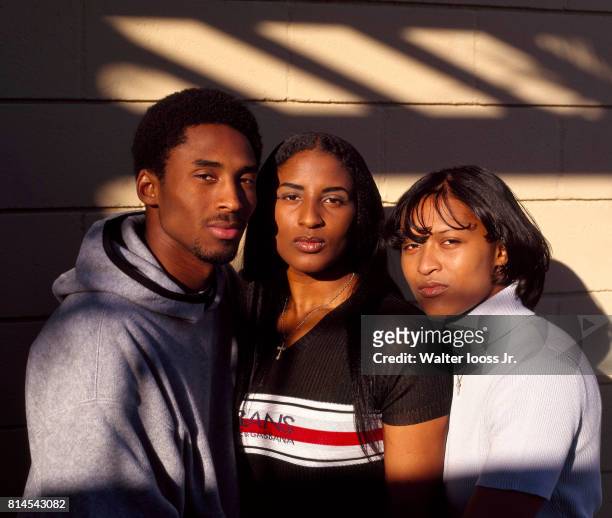 Closeup portrait of Kobe Bryant posing with his sisters Shaya and Sharia during photo shoot. Los Angeles, CA 4/27/1998 CREDIT: Walter Iooss Jr.