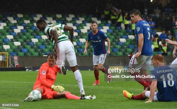 Moussa Dembele of Celtic is denied by Roy Carroll of Linfield during the Champions League second round first leg qualifying game between Linfield and...
