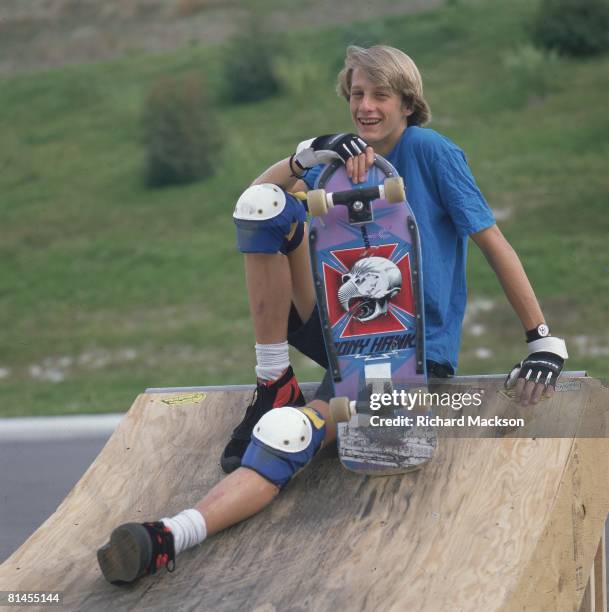 Skateboarding: Portrait of Tony Hawk with board, equipment,