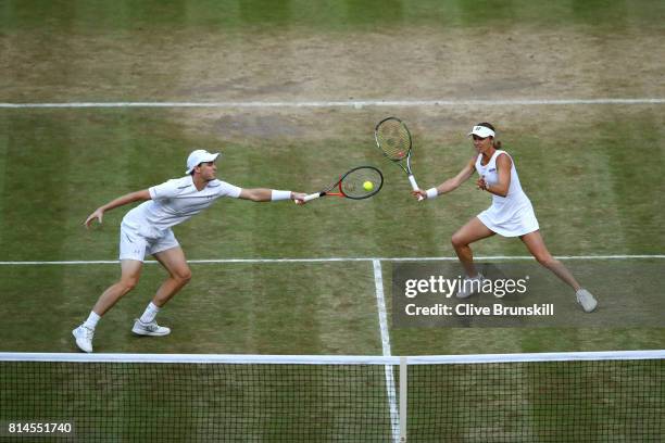 Jamie Murray of Great Britain and Martina Hingis of Switzerland in action during the Mixed Doubles semi final match against Marcelo Demoliner of...