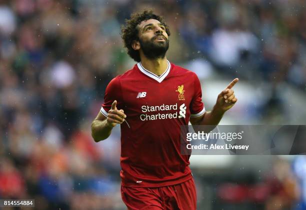 Mohamed Salah of Liverpool celebrates after scoring their first goal during the pre-season friendly match between Wigan Athletic and Liverpool at DW...