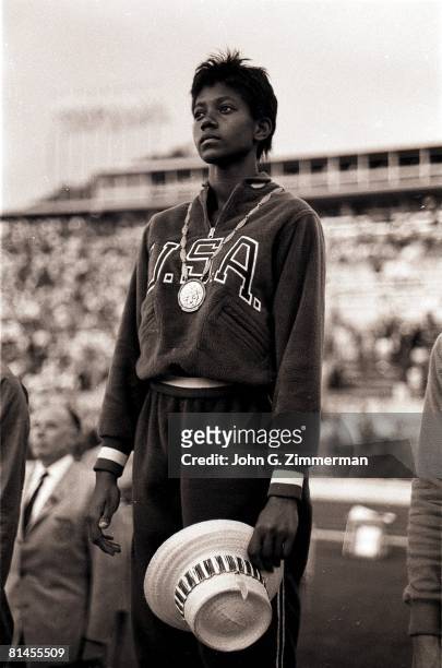 Track & Field: 1960 Summer Olympics, USA Wilma Rudolph victorious with gold medal on stand after winning 200M race, Rome, ITA 8/25/1960--9/11/1960