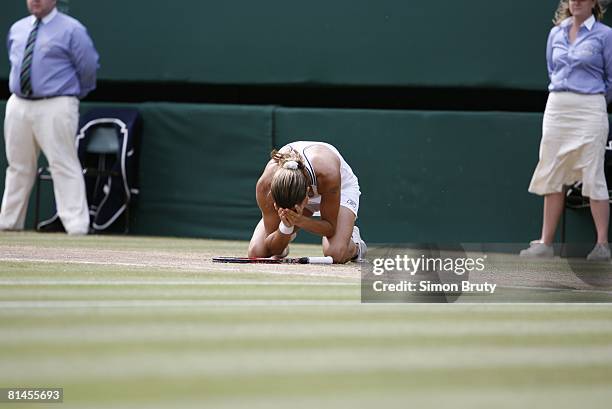Tennis: Wimbledon, France Amelie Mauresmo victorious after winning Finals vs Belgium Justine Henin-Hardenne at All England Club, London, England...