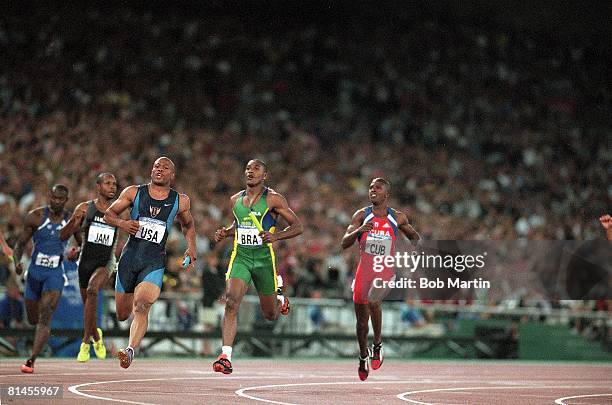 Track & Field: 2000 Summer Olympics, USA Maurice Greene in action, winning 4X100M relay race finals, Sydney, AUS 9/30/2000