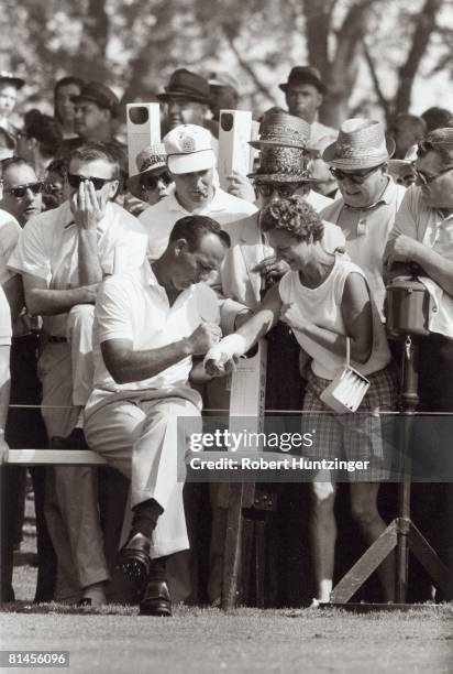 Golf: US Open, Arnold Palmer signing autograph on cast of fan, Oakmont, PA 6/15/1962--6/17/1962