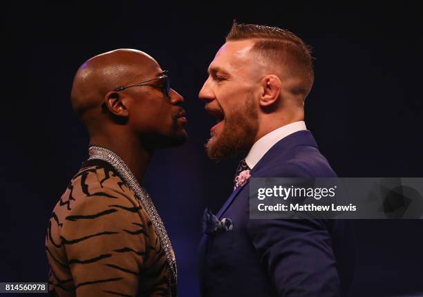 Floyd Mayweather Jr. And Conor McGregor come face to face during the Floyd Mayweather Jr. V Conor McGregor World Press Tour at SSE Arena on July 14,...