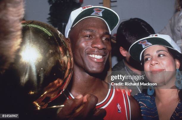 Basketball: finals, Closeup of Chicago Bulls Michael Jordan victorious with wife Juanita and trophy after game vs Los Angeles Lakers, Los Angeles, CA...