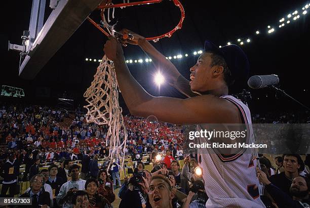 College Basketball: NCAA playoffs, Arizona Sean Elliott victorious, cutting down net after winning game vs North Carolina, Seattle, WA 3/27/1988