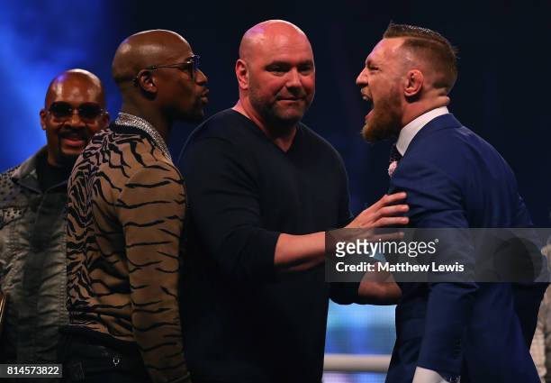 Dana White splits Floyd Mayweather Jr. And Conor McGregor apart during the Floyd Mayweather Jr. V Conor McGregor World Press Tour at SSE Arena on...