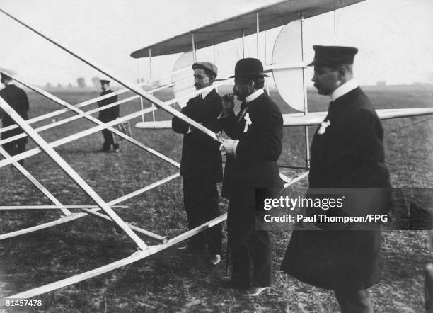 American pilot and inventor Orville Wright prepares for an exhibition flight at Tempelhof Field, Berlin, 1909.