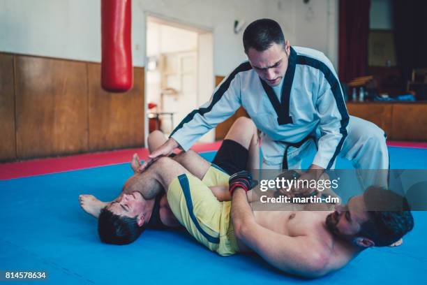 mma training - jujitsu stock pictures, royalty-free photos & images