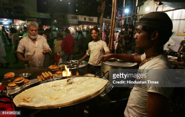 Muslim Festivals Food EID Fayaz Khan and Vakhil Khan prepares the Shahi Paratha at Garib Nawaz Fast Food Corner in Dharavi for Iftaar in holy month...