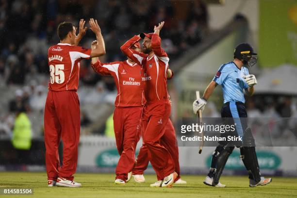 Ryan McLaren high fives Arron Lilley of Lancashire Lightning after getting Adam Lyth of Yorkshire Vikings out during the NatWest T20 Blast match...
