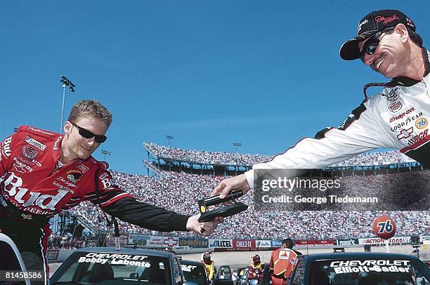 Auto Racing: NASCAR Food City 500, Closeup of Dale Earnhardt Sr, and Dale Earnhardt Jr, during driver introductions before race, Bristol, TN 3/26/2000