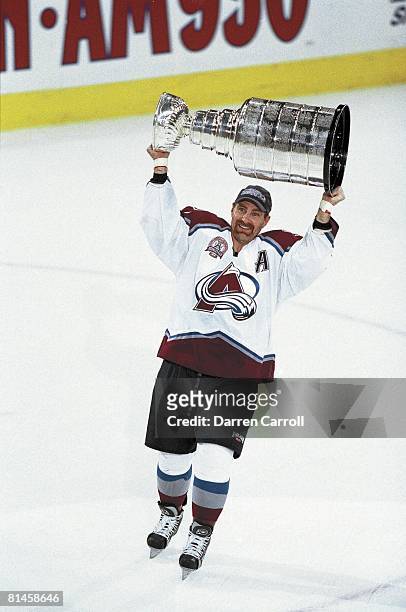 Hockey: NHL Finals, Colorado Avalanche Ray Bourque victorious with Stanley Cup trophy after winning game vs New Jersey Devils, Denver, CO 6/9/2001