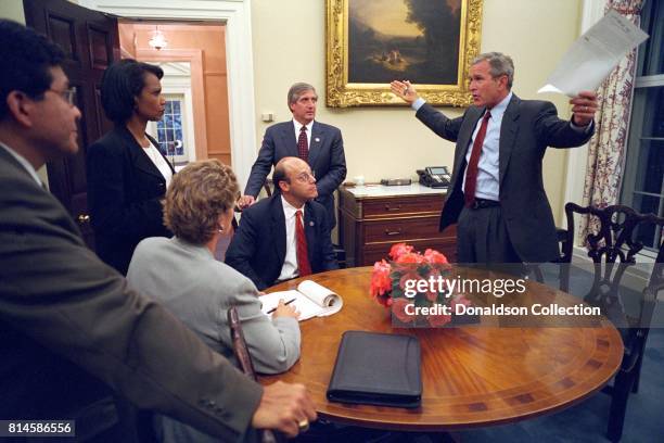 Working with his senior staff, President George W. Bush reviews the speech that he will deliver to the nation the evening of Tuesday, Sept. 11 from...