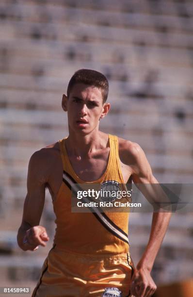 High School Track & Field: Closeup of Wichita East High Jim Ryun in action, preparing for trials during practice, Cover, Lawrence, KS 8/21/1964