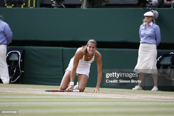 Tennis: Wimbledon, France Amelie Mauresmo victorious after winning Finals vs Belgium Justine Henin-Hardenne at All England Club, London, England...