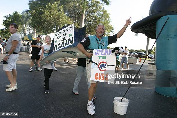 Baseball: NL playoffs, Florida Marlins fans with big fish and SPEAR THE CUBS sign before game vs Chicago Cubs, Miami, FL