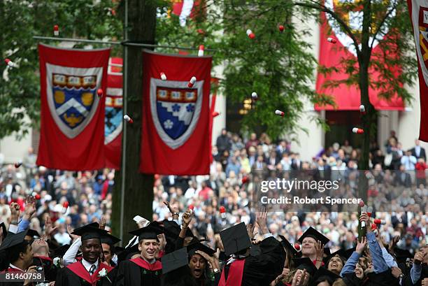 Harvard University Medical School graduates celebrate at comencement ceremonies by tossing giant pills in the air June 5 in Cambridge, Massachusetts....