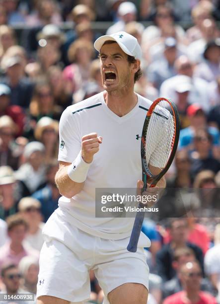 Andy Murray reacts during his quarter-final match against Sam Querrey during day nine of the Wimbledon Lawn Tennis Championships at the All England...