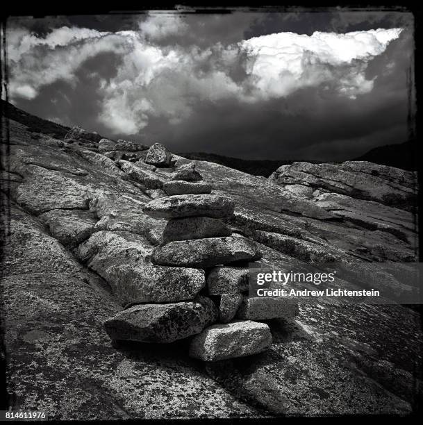 Pile of stacked rocks mark the trail on Baldface Mountain on June 21, 2017 in the White Mountain National Forest along the New Hampshire and Maine...