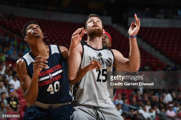 Matt Costello of the Minnesota Timberwolves boxes out against Devin Robinson of the Washington Wizards on July 14, 2017 at the Thomas & Mack Center...
