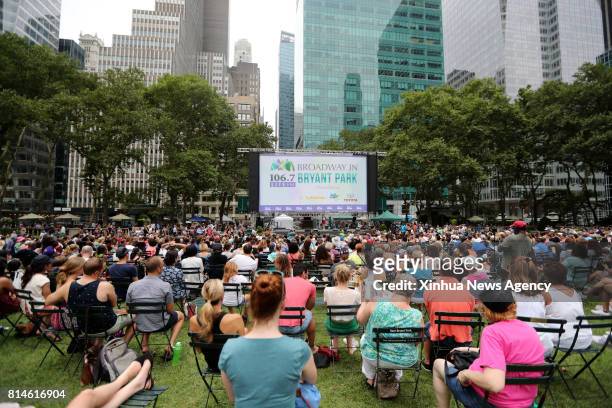 July 13, 2017 -- People watch the performance during Broadway in Bryant Park 2017 show at Bryant Park in New York, the United States, on July 13,...