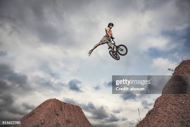 bmx rider jumping high real jump - womens high jump stock pictures, royalty-free photos & images