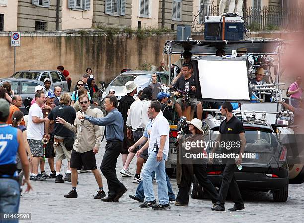 Actor Tom Hanks talks with the crew on the set of the movie "Angels And Demons" at Piazza Del Popolo on June 5, 2008 in Rome, Italy. The movie,...