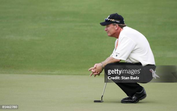 Woody Austin waits for play at he 8th green during the first round of the Stanford St. Jude Championship at TPC Southwind held on June 5, 2008 in...