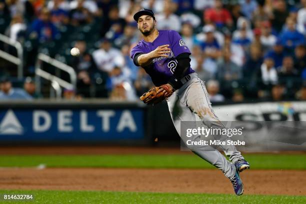 Nolan Arenado of the Colorado Rockies field sth eball for an out in the second inning against the New York Mets at Citi Field on July 14, 2017 in the...