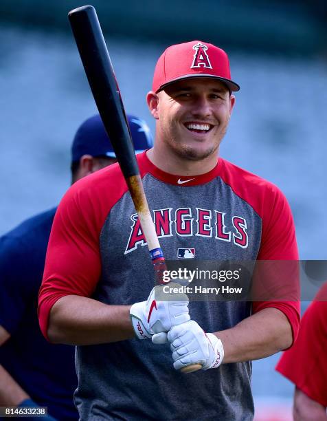 Mike Trout of the Los Angeles Angels smiles at batting practice before the game against the Tampa Bay Rays at Angel Stadium of Anaheim on July 14,...