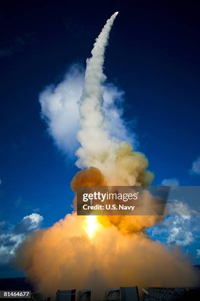 Two modified Standard Missile 2 Block IV interceptors are launched from the guided-missile cruiser USS Lake Erie during a Missile Defense Agency test...