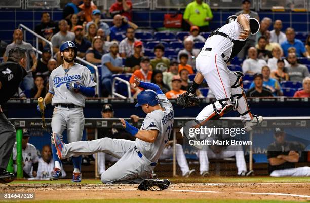 Joc Pederson of the Los Angeles Dodgers scores in the second inning during the game between the Miami Marlins and the Los Angeles Dodgers at Marlins...