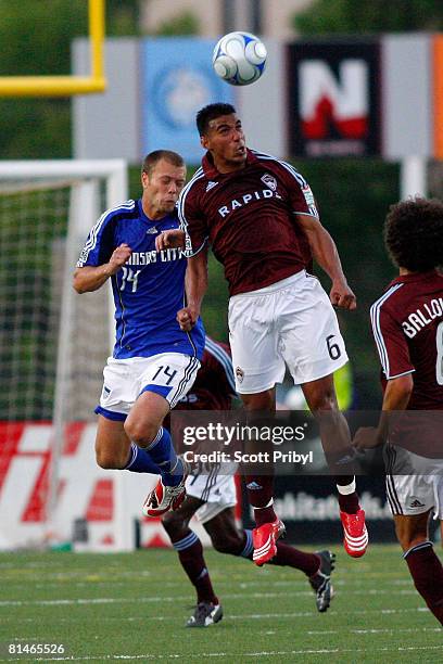 Jose Burciaga Jr. #6 of the Colorado Rapids wins a head ball against Jack Jewsbury of the Kansas City Wizards during the game at Shawnee Mission...