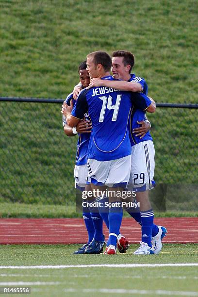 Ryan Pore of the Kansas City Wizards celebrates his goal against the Colorado Rapids during the game at Shawnee Mission North High School on June 4,...