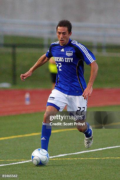 Davy Arnaud of the Kansas City Wizards dribbles against the Colorado Rapids during the game at Shawnee Mission North High School on June 4, 2008 in...