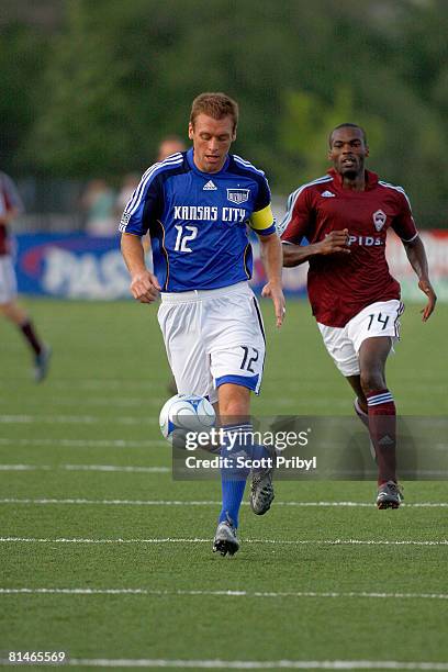 JImmy Conrad of the Kansas City Wizards dribbles the ball against the Colorado Rapids during the game at Shawnee Mission North High School on June 4,...