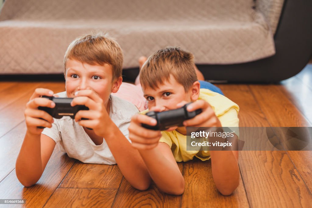 Boy Playing Example Two Boys Playing Games High-Res Stock Photo - Getty Images
