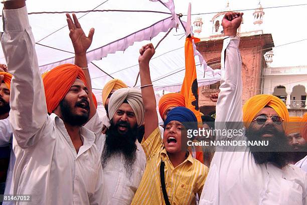 Indian activists from radical Sikh organizations shout slogans in favor of Sant Jarnail Singh Bhindranwale and Khalistan after offering prayers at...